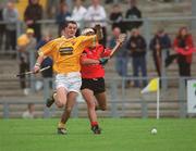 9 June 2002; Liam Watson of Antrim in action against Gabriel Clarke of Downduring the Guinness Ulster Senior Hurling Championship Final match between Antrim and Down at Casement Park in Belfast. Photo by Brian Lawless/Sportsfile