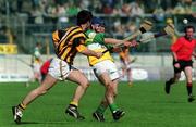 9 June 2002; Offaly's Brian Carroll is tackled by Philip Larkin of Kilkenny during the Guinness Leinster Senior Hurling Championship Semi-Final match between Kilkenny and Offaly at Semple Stadium in Thurles, Tipperary. Photo by Ray McManus/Sportsfile