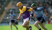 9 June 2002; Wexford's Michael Jordan in action against Philip Brennan of Dublin during the Guinness Leinster Senior Hurling Championship Semi-Final match between Wexford and Dublin at Semple Stadium in Thurles, Tipperary. Photo by Aoife Rice/Sportsfile