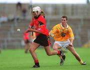 9 June 2002; Gabriel Clarke of Down in action against Antrim's Liam Watson during the Guinness Ulster Senior Hurling Championship Final match between Antrim and Down at Casement Park in Belfast. Photo by Brian Lawless/Sportsfile