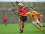 9 June 2002; Gabriel Clarke of Down in action against Antrim's Liam Watson during the Guinness Ulster Senior Hurling Championship Final match between Antrim and Down at Casement Park in Belfast. Photo by Brian Lawless/Sportsfile