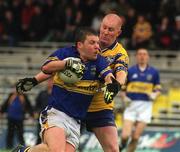 9 June 2002; Paul Cahill of Tipperary is tackled by Neil Hawes of Clare during the Bank of Ireland Munster Senior Football Championship Semi-Final match between Tipperary and Clare at Fitzgerald Stadium in Killarney, Kerry. Photo by Pat Murphy/Sportsfile
