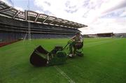 12 June 2002; Groundsman Fergus Finneran cuts the newly laid pitch at Croke Park in Dublin. Photo by Ray McManus/Sportsfile