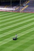 12 June 2002; Groundsman Fergus Finneran cuts the newly laid pitch at Croke Park in Dublin. Photo by Ray McManus/Sportsfile