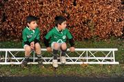 25 December 2011; Christopher O'Connor, six years, and his brother Matthew, 7, from Booterstown, Co Dublin, watch finishers at one of the many GOAL Mile's. Annual Goal Mile, Leopardstown Race Course, Dublin. Picture credit: Ray McManus / SPORTSFILE