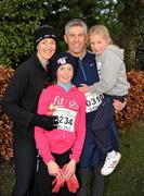 25 December 2011; The O'Brien family, June, left, Paul, Sarah, seven years, and Jennifer, 10, from Foxrock, after finishing one of the many GOAL Mile's. Annual Goal Mile, Leopardstown Race Course, Dublin. Picture credit: Ray McManus / SPORTSFILE