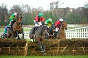 26 December 2011; Askthemaster, with Philip Enright up, jumps the last ahead of Harold's Cross, left, Alan Crowe up, Steel Park, Andrew Leigh, right, and Ross Na Reigh, with Bryan Cooper up, on their way to winning The Download The Free Racing Post Mobile App. Handicap Hurdle. Leopardstown Christmas Racing Festival 2011, Leopardstown Racecourse, Leopardstown, Dublin. Picture credit: Ray McManus / SPORTSFILE