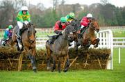 26 December 2011; Askthemaster, with Philip Enright up, race clear of Harold's Cross, left, Alan Crowe up, Steel Park, Andrew Leigh, right, and Ross Na Reigh, with Bryan Cooper up, on their way to winning The Download The Free Racing Post Mobile App. Handicap Hurdle. Leopardstown Christmas Racing Festival 2011, Leopardstown Racecourse, Leopardstown, Dublin. Picture credit: Ray McManus / SPORTSFILE