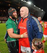 26 December 2011; John Hayes, Munster, after the game with his daughter Sally, age 5, is congratulated by Connacht's John Muldoon. Celtic League, Munster v Connacht, Thomond Park, Limerick. Picture credit: Diarmuid Greene / SPORTSFILE