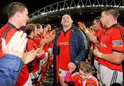 26 December 2011; Munster's John Hayes, accompanied by his daughter Sally, age 5, is applauded off the pitch by his team-mates after the game. Celtic League, Munster v Connacht, Thomond Park, Limerick. Picture credit: Diarmuid Greene / SPORTSFILE