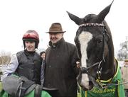 29 December 2011; Trainer Dermot Weld in the parade ring with his horse Unaccompied who he sent out with jockey Paul Townend, left, up to win the Istabraq Festival Hurdle. Leopardstown Christmas Racing Festival 2011, Leopardstown Racecourse, Leopardstown, Dublin. Picture credit: Barry Cregg / SPORTSFILE