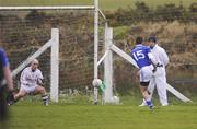 24 December 2011; Daniel Daly, St. Mary's, shoots past Dromid Pearses goalkeeper Alan Hogan to score his side's first goal. South Kerry Senior Football Championship Final, St. Mary's v Dromid Pearses, Waterville Sportsfield, Waterville, Co. Kerry. Picture credit: Stephen McCarthy / SPORTSFILE