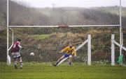 24 December 2011; Thomas Curran, Dromid Pearses, shoots past St. Mary's goalkeeper Damien Horgan for his side's goal from a penalty. South Kerry Senior Football Championship Final, St. Mary's v Dromid Pearses, Waterville Sportsfield, Waterville, Co. Kerry. Picture credit: Stephen McCarthy / SPORTSFILE