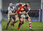 30 December 2011; James Coughlan, Munster, is tackled by Dan Tuohy and Ian Humphreys, Ulster. Celtic League, Ulster v Munster, Ravenhill Park, Belfast, Co. Antrim. Picture credit: Oliver McVeigh / SPORTSFILE