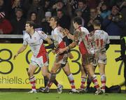 30 December 2011; Ruan Pienaar, Ulster, second from left, gets congratulated by Darren Cave and Ian Whitten after scoring his side's fourth try. Celtic League, Ulster v Munster, Ravenhill Park, Belfast, Co. Antrim. Picture credit: Oliver McVeigh / SPORTSFILE