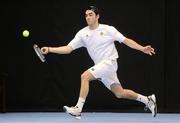31 December 2011; Niall Fitzgerald, Greystones, Co. Wicklow, on his way to winning the Men's singles final against Lazare Kukhalashvili, DCU, Co. Dublin. National Indoor Tennis Championship Finals, David Lloyd Riverview, Clonskeagh, Dublin. Picture credit: Pat Murphy / SPORTSFILE