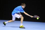 31 December 2011; Morgan Lohan, Waterford, on his way to winning the Boy's U14 Final against Michael Silvester, Dublin. National Indoor Tennis Championship Finals, David Lloyd Riverview, Clonskeagh, Dublin. Picture credit: Pat Murphy / SPORTSFILE