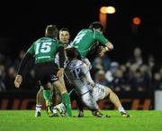 1 January 2012; Brian Tuohy, supported by Connacht full-back Gavin Duffy, is tackled by Brendan Macken and Eoin O'Malley, left, Leinster. Tuohy was stretchered off after this incident. Celtic League, Connacht v Leinster, Sportsground, Galway. Picture credit: Ray McManus / SPORTSFILE