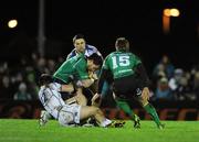 1 January 2012; Brian Tuohy, supported by Connacht full-back Gavin Duffy, is tackled by Brendan Macken, 12,  and Eoin O'Malley, Leinster. Tuohy was stretchered off after this incident. Celtic League, Connacht v Leinster, Sportsground, Galway. Picture credit: Ray McManus / SPORTSFILE