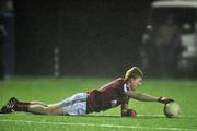 4 January 2012; Conor Walsh, NUIG, keeps the ball steady in the windy conditions for his team-mate to kick a free during the game. FBD Insurance League, Section A, Round 1, Sligo v NUIG, Connacht GAA Centre of Excellence, Ballyhaunis, Co. Mayo. Picture credit: David Maher / SPORTSFILE