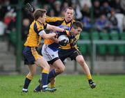 8 January 2012; Niall Gaffney, Wicklow, is tackled by Colm Begley and Dean Rock,  DCU. Bord Na Mona O'Byrne Cup, First Round, Wicklow v DCU, Baltinglass GAA Club, Newtownsaunders, Baltinglass, Co. Wicklow. Picture credit: Matt Browne / SPORTSFILE