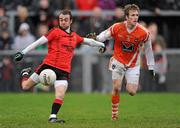 8 January 2012; Conor Laverty, Down, in action against David Lavery, Armagh, on his way to scoring his side's second goal. Dr. McKenna Cup, Section B, Down v Armagh, Pairc Esler, Newry, Co. Down. Picture credit: Oliver McVeigh / SPORTSFILE