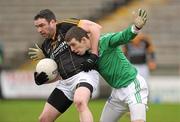 8 January 2012; Michael Magill, Antrim, in action against Barry Owens, Fermanagh. Dr. McKenna Cup, Section A, Fermanagh v Antrim, Brewster Park, Enniskillen, Co. Fermanagh. Photo by Sportsfile