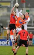 8 January 2012; Conor Gough, Down, contests a high ball against Billy Joe Padden and Anto Duffy, Armagh. Dr. McKenna Cup, Section B, Down v Armagh, Pairc Esler, Newry, Co. Down. Picture credit: Oliver McVeigh / SPORTSFILE