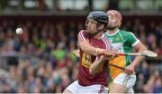 27 May 2017; Paul Greville of Westmeath clears ahead of Peter Geraghty of Offaly during the Leinster GAA Hurling Senior Championship Quarter-Final match between Westmeath and Offaly at TEG Cusack Park in Mullingar, Co Westmeath. Photo by Piaras Ó Mídheach/Sportsfile