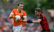 4 June 2017; Brendan Donaghy of Armagh in action against Barry O'Hagan of Down during the Ulster GAA Football Senior Championship Quarter-Final match between Down and Armagh at Páirc Esler, in Newry. Photo by Daire Brennan/Sportsfile