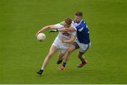 4 June 2017; Daniel Flynn of Kildare in action against Denis Booth of Laois during the Leinster GAA Football Senior Championship Quarter-Final match between Laois and Kildare at O'Connor Park, in Tullamore, Co. Offaly.   Photo by Piaras Ó Mídheach/Sportsfile