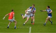 4 June 2017; Daniel Flynn of Kildare in action against Laois players, from left, Graham Brody, Denis Booth and Pádraig McMahon during the Leinster GAA Football Senior Championship Quarter-Final match between Laois and Kildare at O'Connor Park, in Tullamore, Co. Offaly.   Photo by Piaras Ó Mídheach/Sportsfile