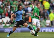 4 May 2017; Glenn Whelan of Republic of Ireland in action against Edinson Cavani of Uruguay during the international friendly match between Republic of Ireland and Uruguay at the Aviva Stadium in Dublin. Photo by Ramsey Cardy/Sportsfile