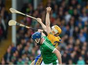 4 June 2017; Aaron Cunningham of Clare wins possession ahead of Limerick full back Richie Mccarthy during the Munster GAA Hurling Senior Championship Semi-Final match between Limerick and Clare at Semple Stadium, in Thurles, Co. Tipperary. Photo by Ray McManus/Sportsfile