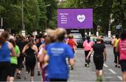 5 June 2017; Runners make their way past the big screen at the 9km mark during the VHI Women’s Mini Marathon 2017. Nearly 33,000 participants took to the streets of Dublin to run, walk and jog the 10km route, raising much needed funds for hundreds of charities around the country. For further information please log on to www.vhiwomensminimarathon.ie Photo by Eóin Noonan/Sportsfile