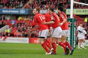14 January 2012; Johne Murphy, Munster, celebrates with team-mates Damien Varley, and Conor Murray after scoring his side's first try. Heineken Cup, Pool 1, Round 5, Munster v Castres Olympique, Thomond Park, Limerick. Picture credit: Diarmuid Greene / SPORTSFILE
