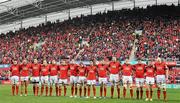 14 January 2012; Munster players stand together during a minute's silence in memory of former Munster and Ireland player Colm Tucker. Heineken Cup, Pool 1, Round 5, Munster v Castres Olympique, Thomond Park, Limerick. Picture credit: Diarmuid Greene / SPORTSFILE