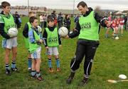 14 January 2012; Brendan Cummins, Tipperary, demonstrates a kicking skill to, from left, Donal O'Connel, Cian O'Rahilly, John Moloney, and Chris O'Hagan at the inaugural AIB GAA Skills Challenge Day in Na Piarsaigh GAA are. AIB, proud sponsors of the GAA Club Championships joined up with the Limerick Senior Hurling Champions to celebrate the club’s county and provincial successes and acknowledge the role which the club plays in the community by supporting them in hosting the first ever AIB GAA Skills Challenge Day. Na Piarsaigh GAA, Limerick. Picture credit: Pat Murphy / SPORTSFILE