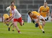 15 January 2012; Peter Hughes, Tyrone, in action against James Loughrey, Antrim. Power NI Dr. McKenna Cup, Section A, Antrim v Tyrone, Casement Park, Belfast, Co. Antrim. Picture credit: Oliver McVeigh / SPORTSFILE