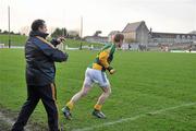 15 January 2012; Graham Geraghty, Meath selector and player, runs out onto the pitch as a substitute during the second half of the game beside manager Seamus McEnaney. Bord na Mona O'Byrne Cup, Quarter-Final, Meath v Louth, Pairc Tailteann, Navan, Co. Meath. Picture credit: David Maher / SPORTSFILE