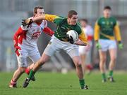 15 January 2012; Brian Menton, Meath, in action against Mark Brennan, Louth. Bord na Mona O'Byrne Cup, Quarter-Final, Meath v Louth, Pairc Tailteann, Navan, Co. Meath. Picture credit: David Maher / SPORTSFILE