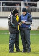 15 January 2012; Kildare manager Kieran McGeeney reads the match programme with selectors, John Rafferty, left, and Niall Carew before the game. Bord na Mona O'Byrne Cup, Quarter-Final, Kildare v Offaly, St Conleth's Park, Newbridge, Co. Kildare. Picture credit: Dáire Brennan / SPORTSFILE