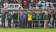 15 January 2012; Kildare manager Kieran McGeeney and the Kildare mentors and substitutes stand for the National Anthem. Bord na Mona O'Byrne Cup, Quarter-Final, Kildare v Offaly, St Conleth's Park, Newbridge, Co. Kildare. Picture credit: Dáire Brennan / SPORTSFILE