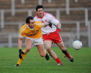 15 January 2012; Brian Neeson, Antrim, in action against PJ Quinn, Tyrone. Power NI Dr. McKenna Cup, Section A, Antrim v Tyrone, Casement Park, Belfast, Co. Antrim. Picture credit: Oliver McVeigh / SPORTSFILE