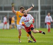 15 January 2012; Mark Donnelly, Tyrone, in action against James Loughrey, Antrim. Power NI Dr. McKenna Cup, Section A, Antrim v Tyrone, Casement Park, Belfast, Co. Antrim. Picture credit: Oliver McVeigh / SPORTSFILE