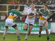 15 January 2012; Tommy Moolick, Kildare, in action against Seán Pender, left, and Paul McConway, Offaly. Bord na Mona O'Byrne Cup, Quarter-Final, Kildare v Offaly, St Conleth's Park, Newbridge, Co. Kildare. Picture credit: Dáire Brennan / SPORTSFILE