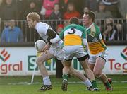15 January 2012; Tomás O'Connor, Kildare, in action against Paul McConway, left, and Ross Brady, Offaly. Bord na Mona O'Byrne Cup, Quarter-Final, Kildare v Offaly, St Conleth's Park, Newbridge, Co. Kildare. Picture credit: Dáire Brennan / SPORTSFILE