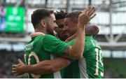 4 May 2017; Jonathan Walters of Republic of Ireland celebrates with teammates Robbie Brady, left, and Cyrus Christie, centre, after scoring his side's first goal during the international friendly match between Republic of Ireland and Uruguay at the Aviva Stadium in Dublin. Photo by Ramsey Cardy/Sportsfile