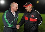 18 January 2012; Fermanagh manager Peter Canavan, left, and Tyrone manager Mickey Harte shake hands before the game. Power NI Dr. McKenna Cup, Section A, Tyrone v Fermanagh, Healy Park, Omagh, Co. Tyrone. Picture credit: Oliver McVeigh / SPORTSFILE