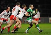 18 January 2012; Daniel Killie, Fermanagh, in action against Peter Hughes and Sean O'Neill, Tyrone. Power NI Dr. McKenna Cup, Section A, Tyrone v Fermanagh, Healy Park, Omagh, Co. Tyrone. Picture credit: Oliver McVeigh / SPORTSFILE